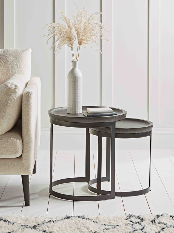 nesting tables save space in a living area