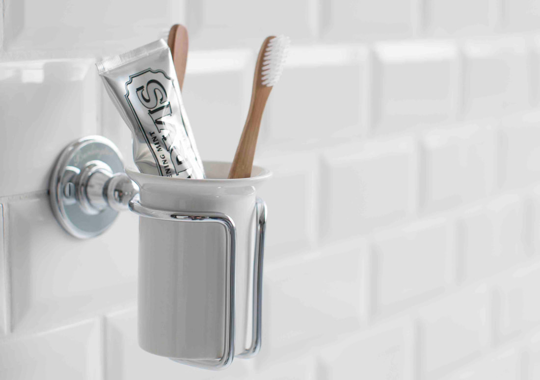 Wall-hung toothbrush holder